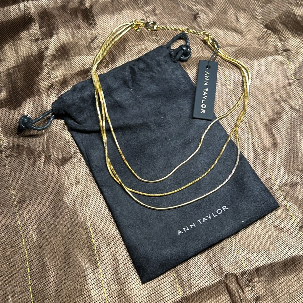 Ann Taylor Necklace 

triple strand necklace. 16" length with 2" extender.